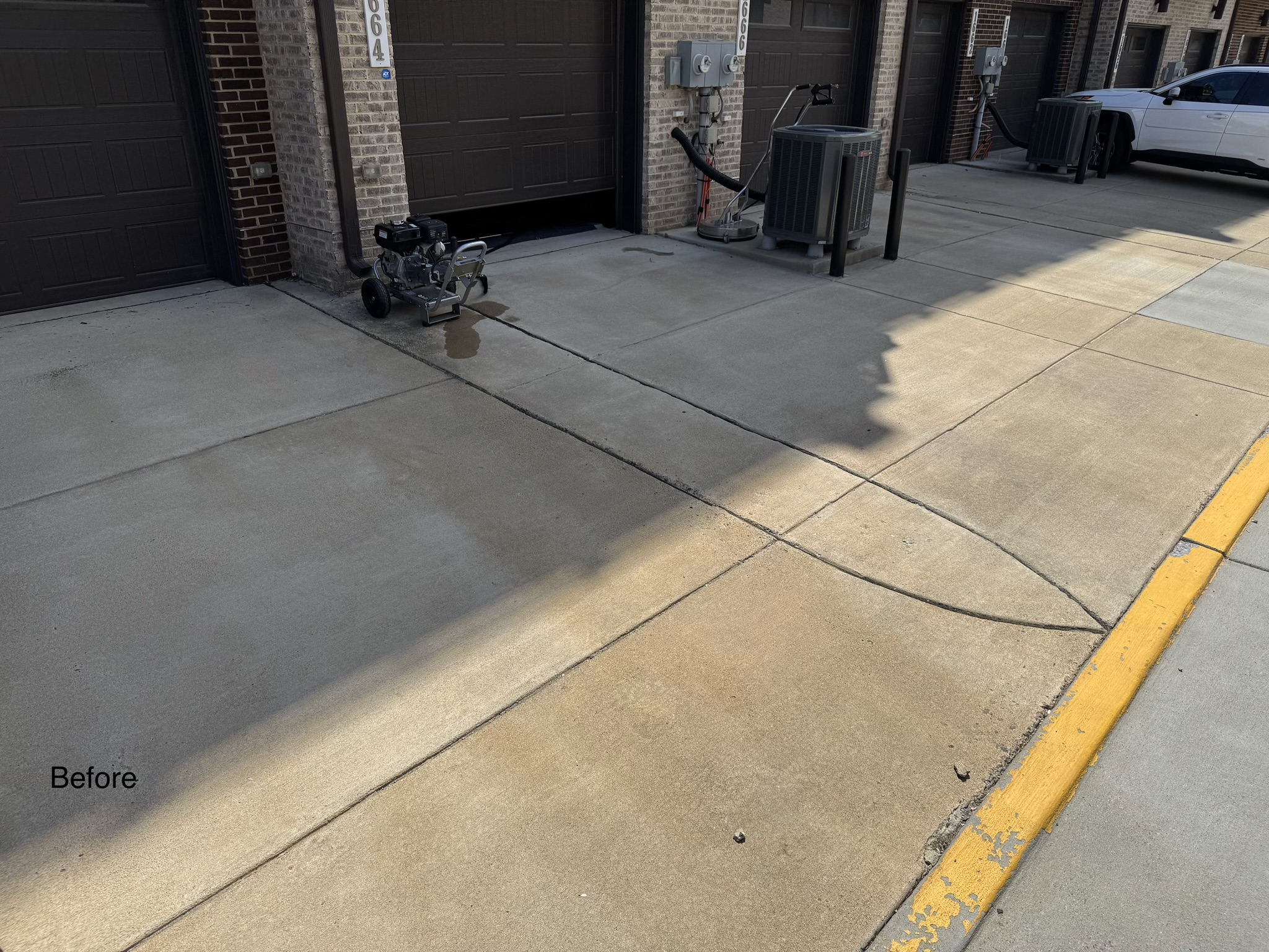 Stained driveway before pressure washing